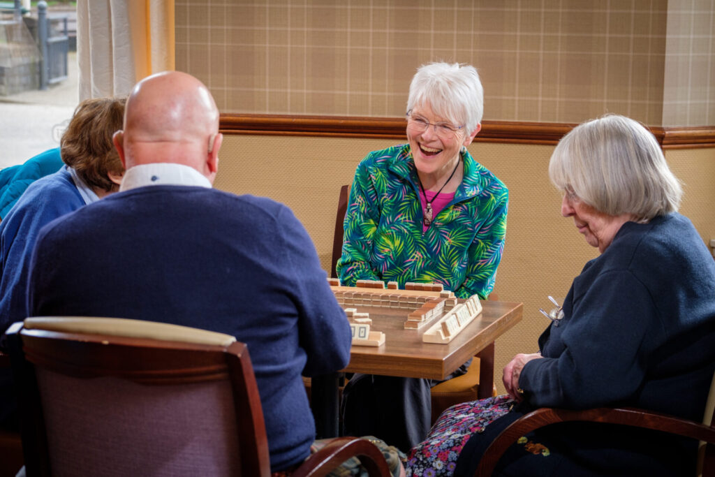 Four people playing mahjong